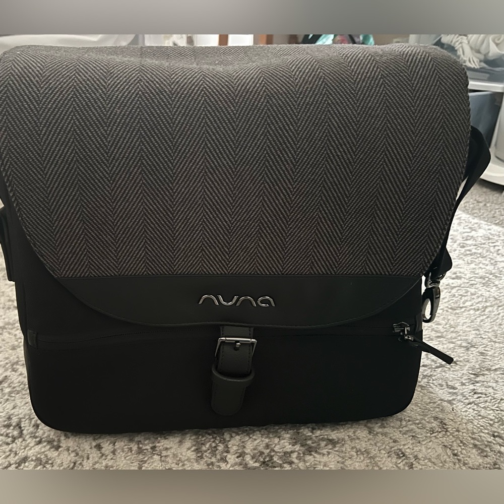 Black and Gray Nuna diaper bag comes with changing pad and bottle warmer!
